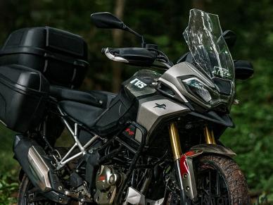 TVS Apache RTX 300 adventure motorcycle displayed with touring accessories and rugged design